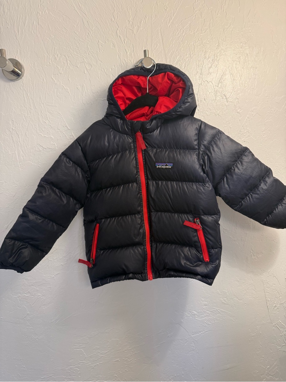 Patagonia kids navy puffer jacket with red accents